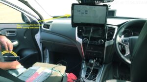 Testing equipment positioned near the vehicle centre console